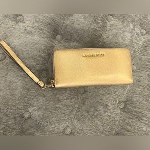 Gold large Michael Kors wallet.
